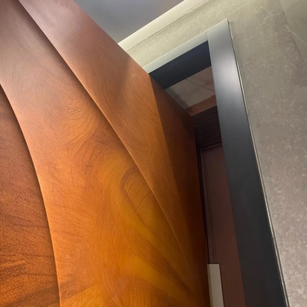 3D relief wood grain panel detail on modern pivot front door