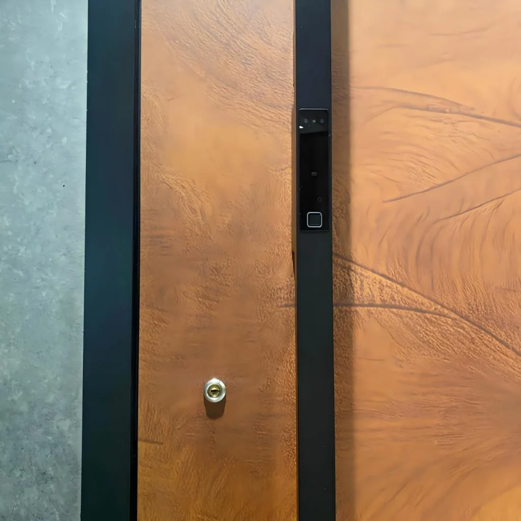close-up of custom pivot front door with smart lock and brown wood panel